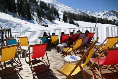 People on snowcapped mountains during winter