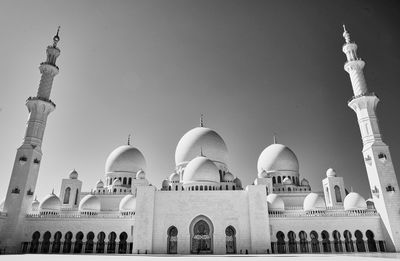 Low angle view of mosque against clear sky