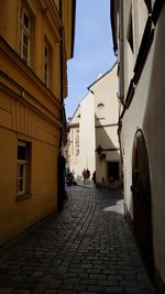 Narrow alley amidst buildings in city