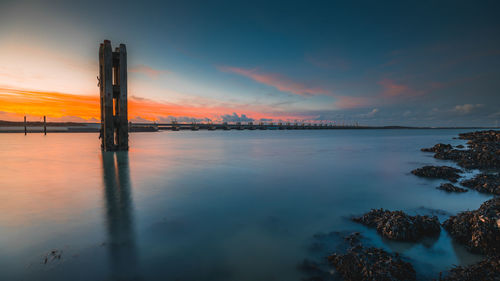 Scenic view of sea against sky during sunset