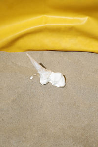 High angle view of shoes on sand