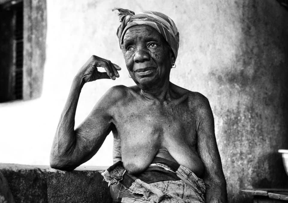 PORTRAIT OF SHIRTLESS MAN WEARING WALL