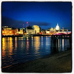 Reflection of illuminated buildings in water at night