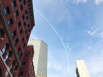 Low angle view of skyscrapers against sky