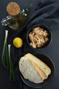 Ingredients to make greek fish roe dip ,known as taramosalata on black background