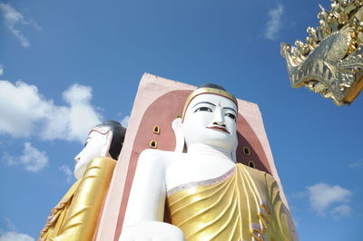 Low angle view of large buddha statues