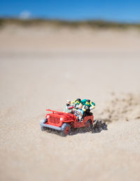 Toy car on sand