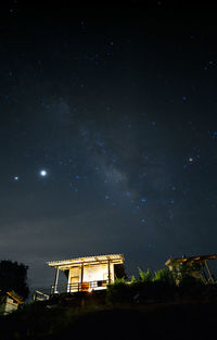 Low angle view of building against sky at night