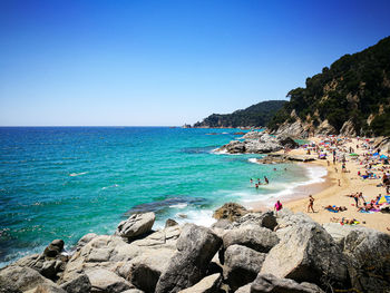 Scenic view of sea against clear blue sky