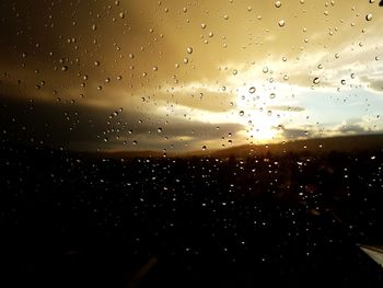 Full frame shot of wet glass window during rainy season