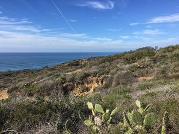 Scenic view of sea against blue sky