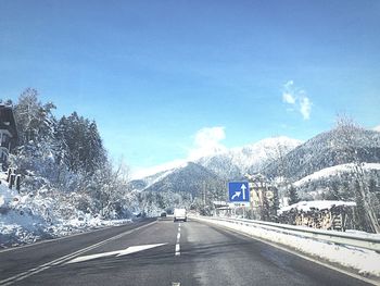 Scenic view of snow covered mountains against sky