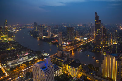 Overview of bangkok with the chao praya river at dusk