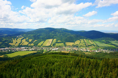 Scenic view of landscape and mountains against sky