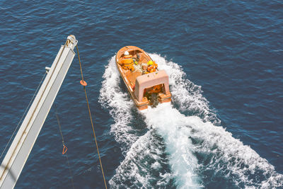 High angle view of sailboat sailing in sea