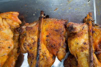 High angle view of meat on barbecue