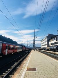 Train at railroad station against sky