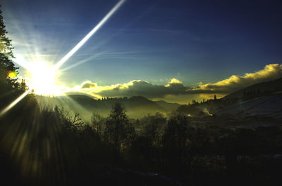 Sun shining through clouds