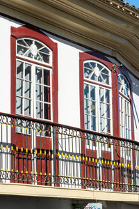 Low angle view of building seen through window