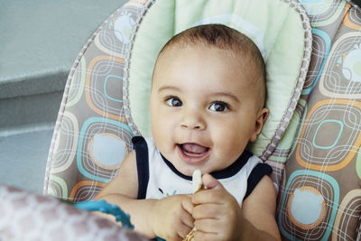 Portrait of smiling baby boy at home