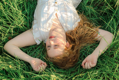 Woman lying down on field