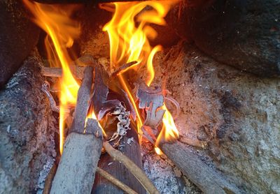 High angle view of fire on wood at night