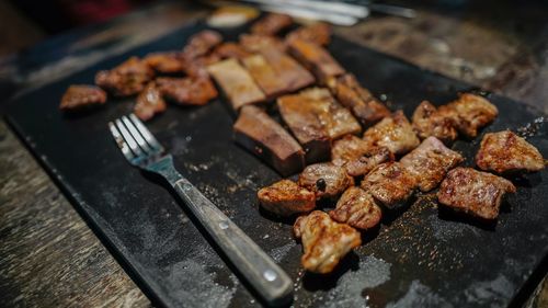 Close-up of meat on grill