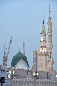 View of buildings in city against clear sky