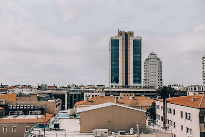 Buildings in city against sky