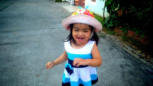 Smiling girl running on road