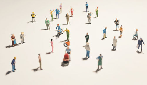 High angle view of figurines on white background