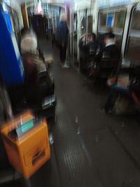 Blurred motion of man in bus