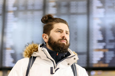 Portrait of young man looking away