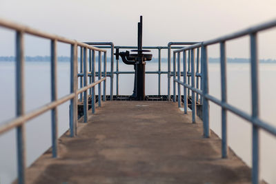 The walkway opens and closes the dam's water gate.