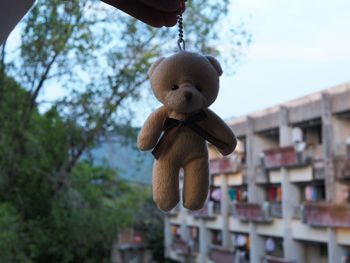 Close-up of man hand holding stuffed toy