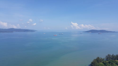 Scenic view of sea against blue sky