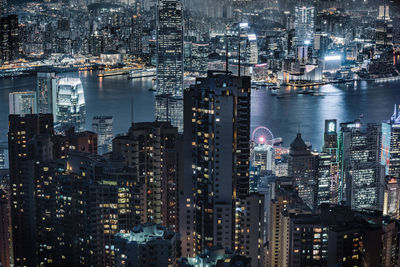 High angle view of city lit up at night