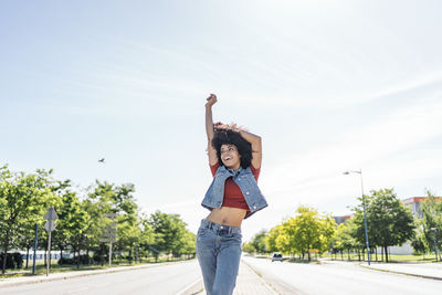 Portrait of a young black woman in the middle of the road