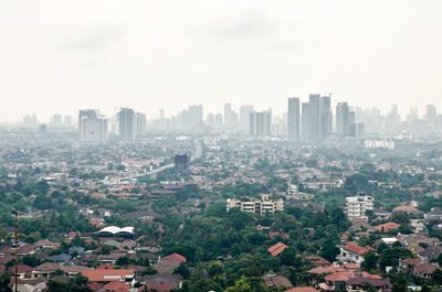 High angle view of buildings in city against sky