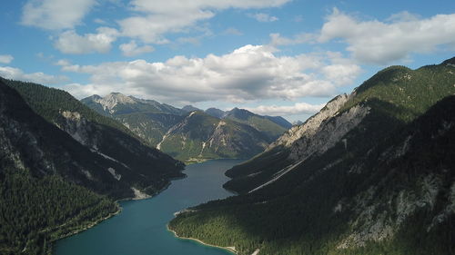 Scenic view of lake and mountains against sky