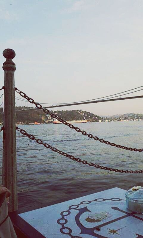 water, sea, railing, sky, connection, built structure, bridge - man made structure, metal, pier, architecture, river, clear sky, safety, protection, tranquility, copy space, outdoors, transportation, day, nautical vessel