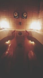 Low section of woman in bathtub