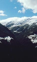 Scenic view of snow covered mountains against sky