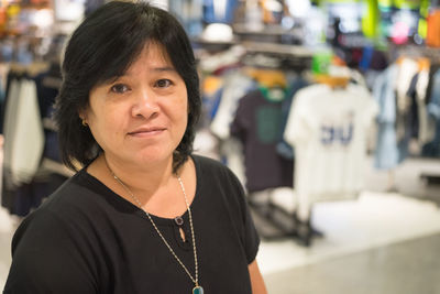 Portrait of woman standing in store