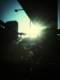 Sun shining through city