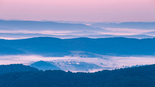 Scenic view of mountains against sky during sunset