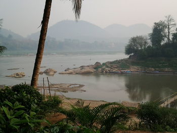 Scenic view of lake with mountains in background