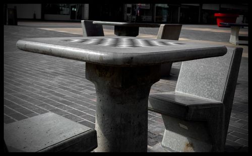 Close-up of empty chairs and table