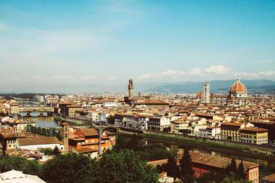 Aerial view of townscape against sky