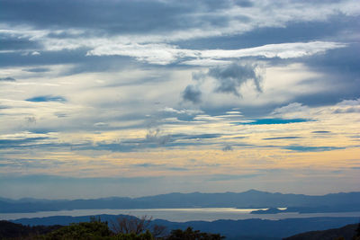 Scenic view of silhouette mountains against sky at sunset